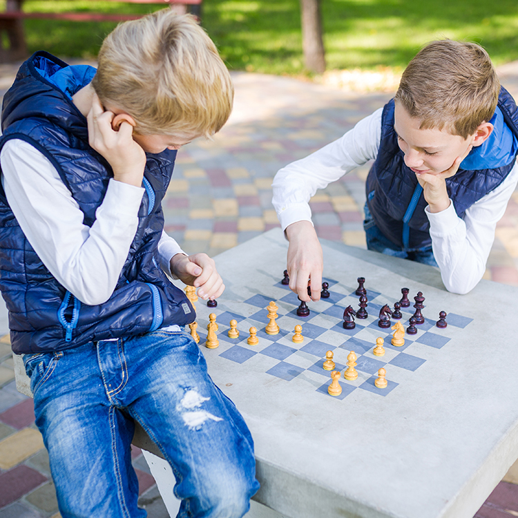 2 boys playing chess