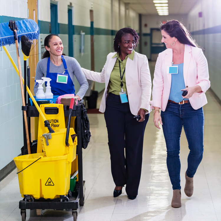 Cleaning team walking through corridor