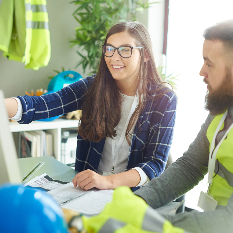 Site workers at a computer